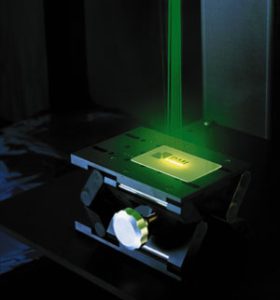 Green laser marking the RMI Laser logo