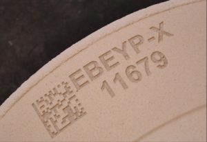 Up close image of a QR code marked on an industrial element