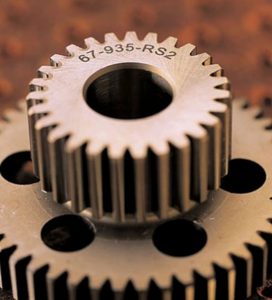 Up close image of a gear with a laser marking on the side